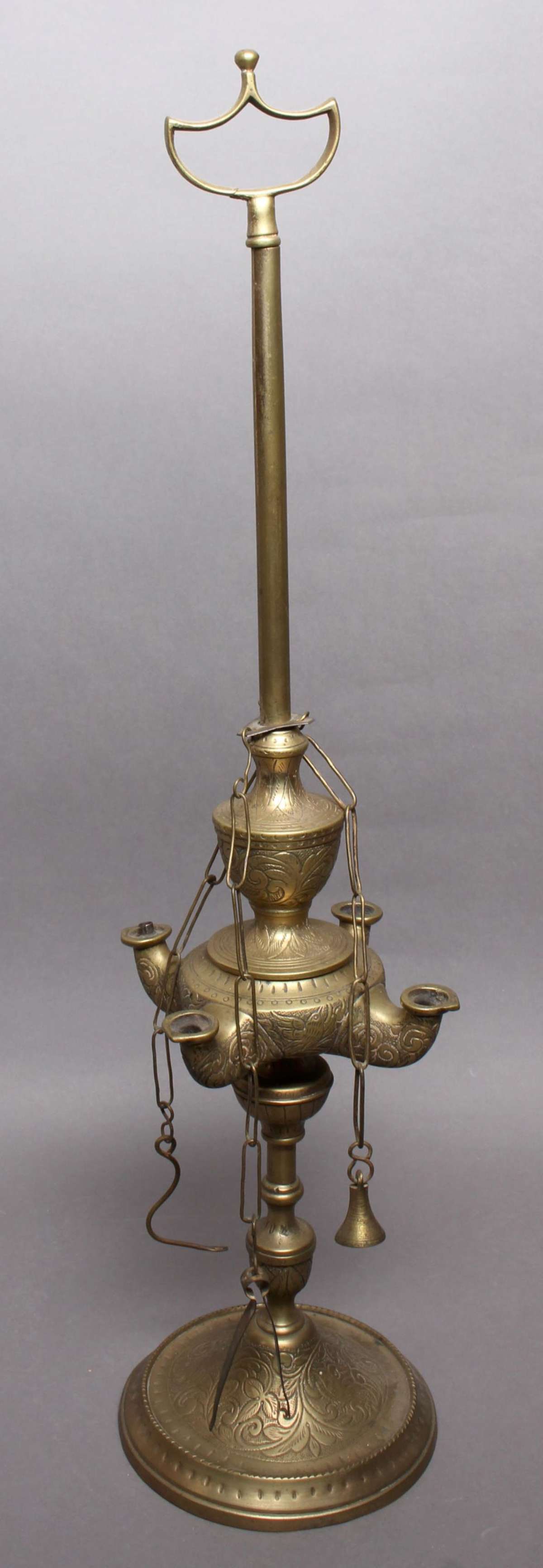 vintage brass table lamp: not sure if this is an incense or an oil lamp, tall model with handle for easy carrying around, possibly Middle Eastern or Indian (?) and with beautiful engraved swirl design
