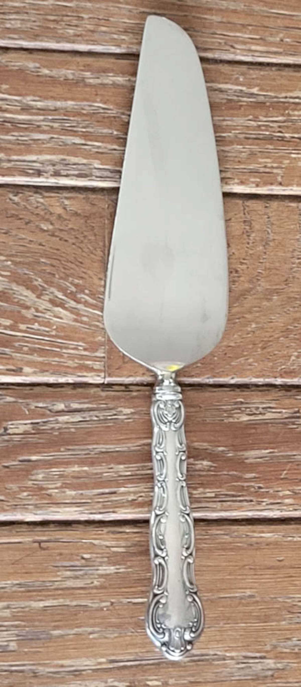 Sterling silver Gorham flatware - cake knife: antique marked Sterling Gorham cake knife or serving spoon, with elaborate handle and stainless steel blade total weight 102 grams, with stainless blade surface Info from online search: