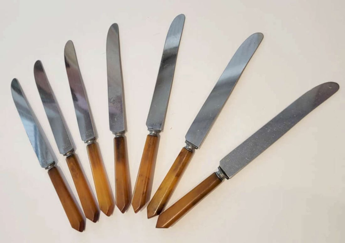 vintage set of 7 Bakelite handled fruit knives: antique Art Deco Era cutlery or flatware set consisting of 7 matching fruit or breakfast knives, each with Butterscotch and Caramel colored Bakelite handle and marked Stainless Steel blade