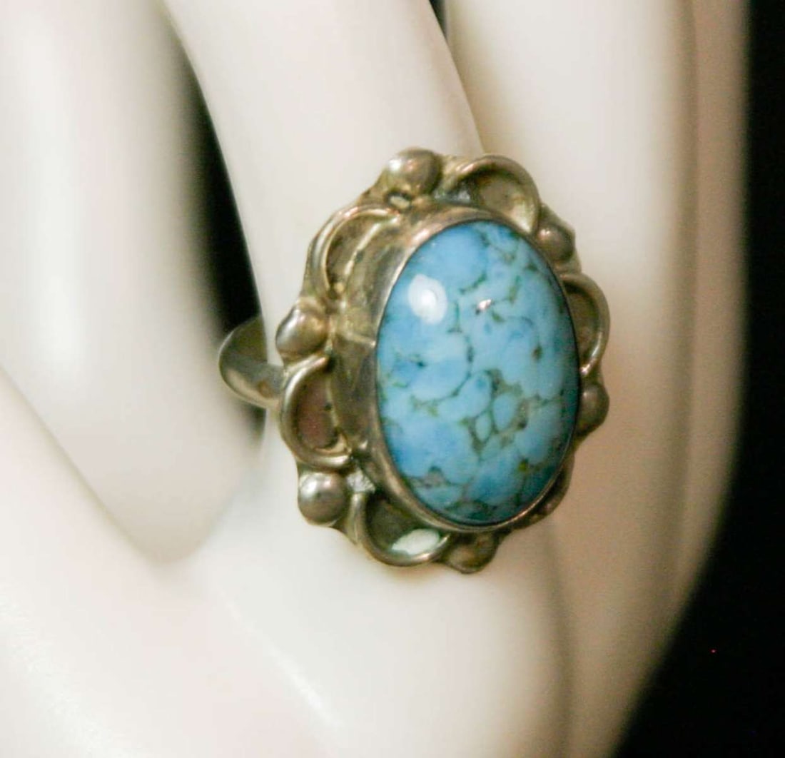 vintage estate jewelry: Native American ring: unmarked but most likely silver ring with illegible maker's or artist's name stamp as shown, nicely designed ring with large cabochon of blue Turquoise in the center aprox 5 1/2 ring s