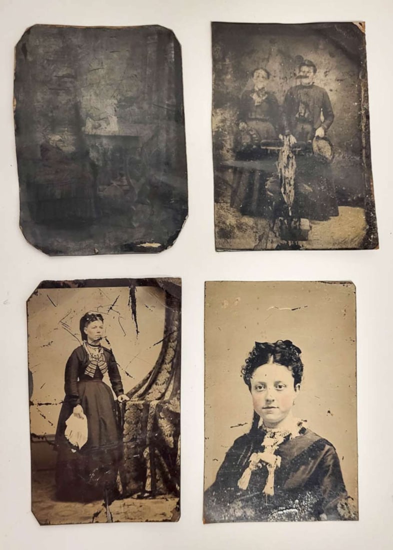 four antique tintype photographs: set or lot of four ca. 1890's tintype photographs, all of ladies or young women, either seated or standing in interior scenes, with hand tinted cheeks or dress accents
