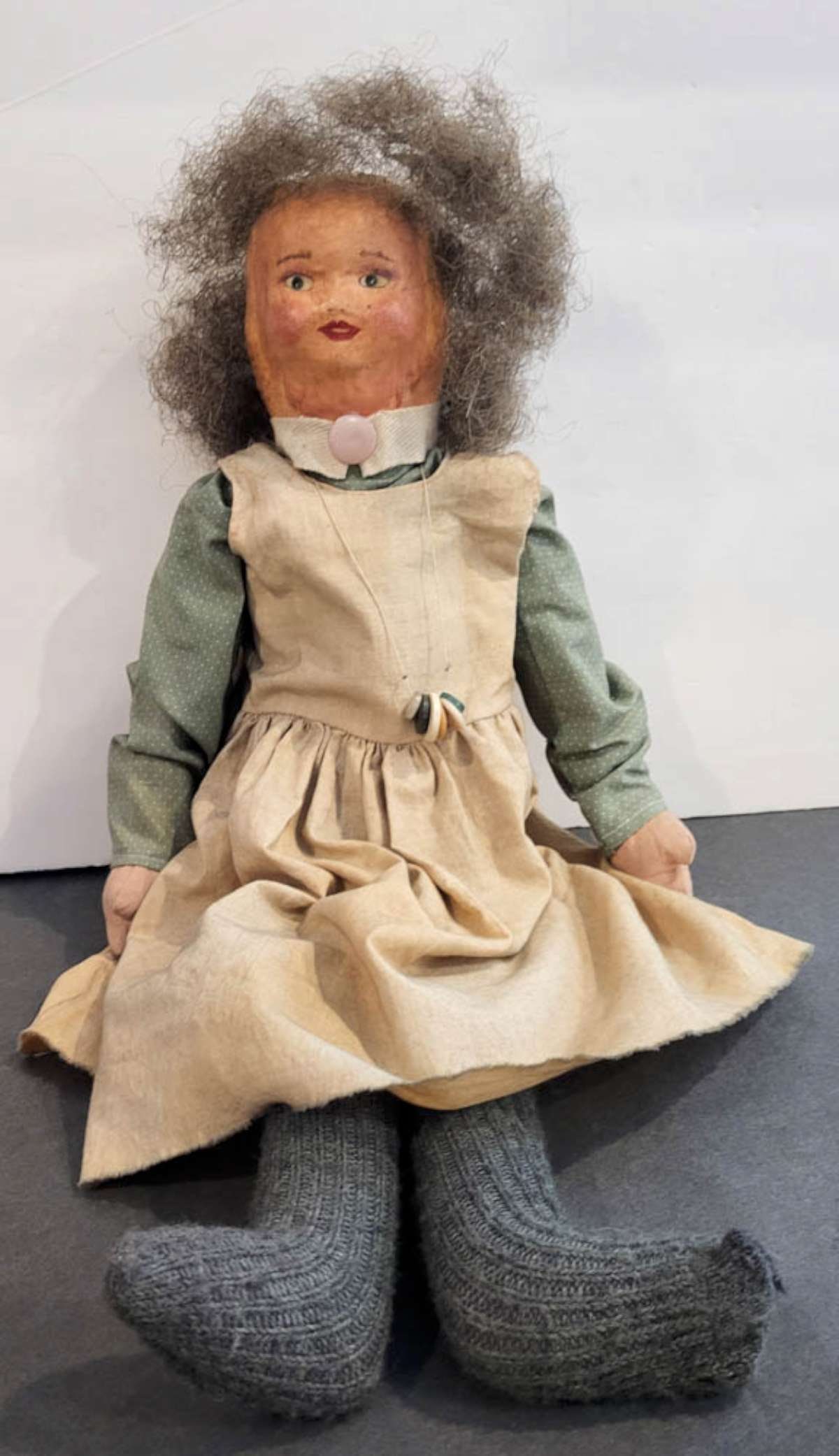 vintage or antique Folk Art doll: hand made cloth body doll with paper mache head, hand painted features and peasant clothing and steel wool wired hair, no maker's mark and not sure of her age about 22 1/2" tall 