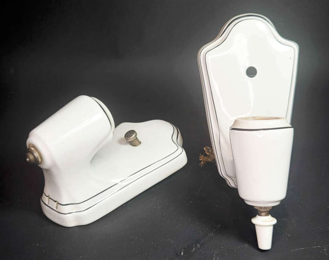 pair antique Art Deco wall sconces: set or lot of two vintage or antique Art Deco period white pottery or porcelain wall hung lamps or light fixtures, with black edge detail and outlet in the base