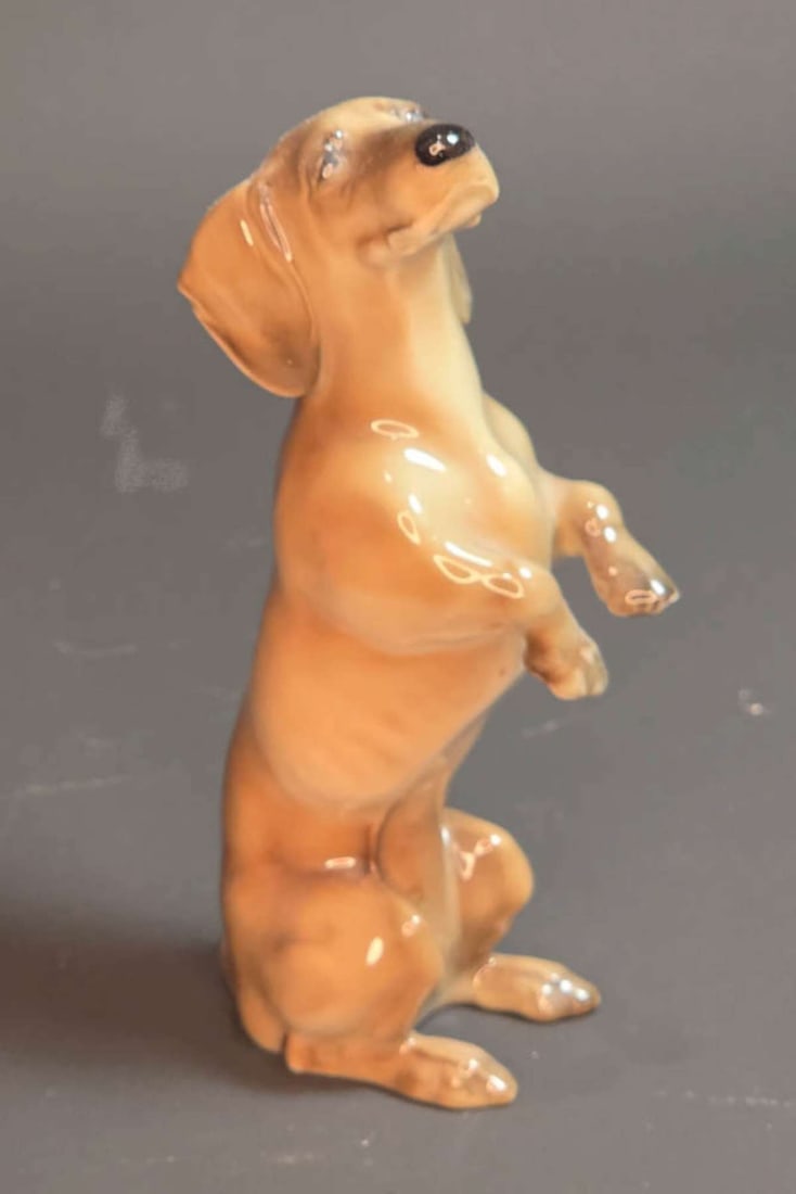 vintage porcelain Dachshund figural statue: vintage porcelain figurine shaped like an adorable dog on his hind legs, marked Hutschenreuther as shown