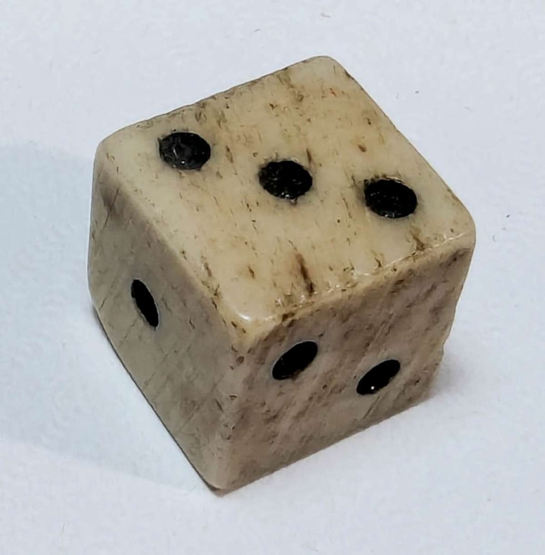 antique bone gambling dice: ivory or cream colored small antique carved bone die with painted black dots almost 1/2" squared