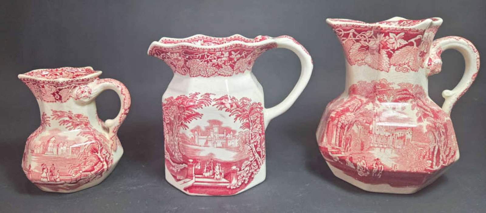 three English ironstone transferware handled pitchers (1 of 10)