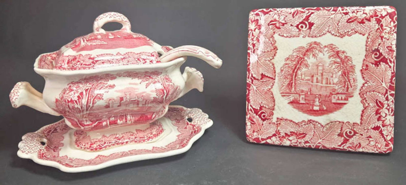 pair English ironstone transferware pieces: set or lot of two beautiful vintage or antique ironstone china pieces, including a small double-handled soup tureen with lid, ladle and underplate and a square trivet or pot holder, 