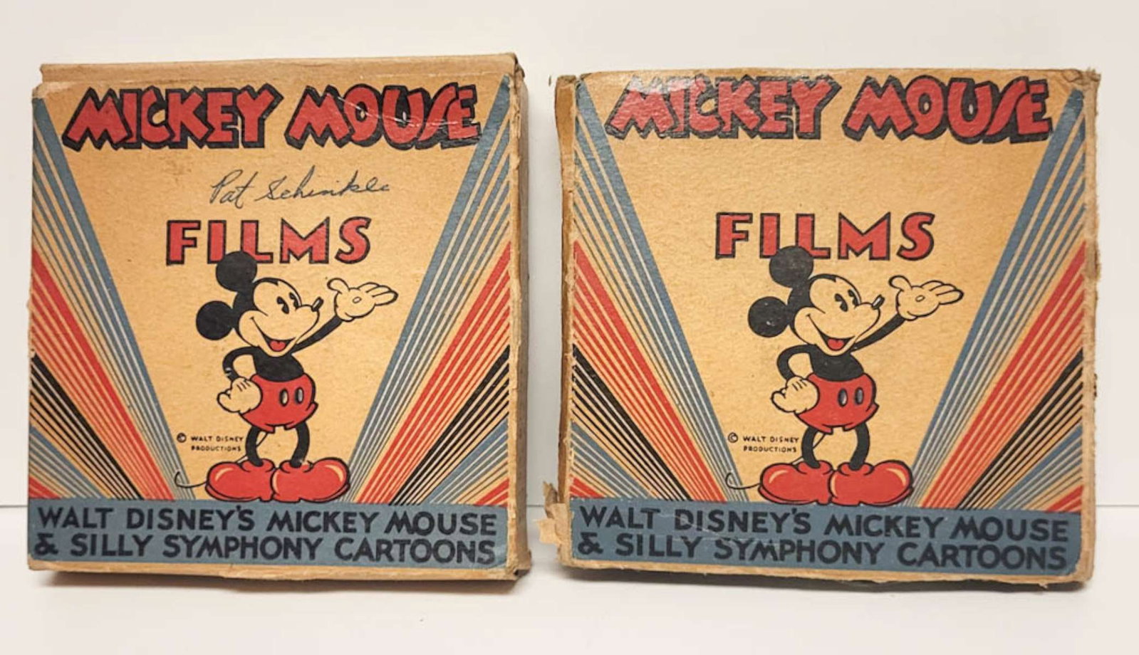 pair vintage Disney 8mm film reels: ca. 1930's or 40's Walt Disney's Mickey Mouse Silly Symphony cartoon reels, one for 1410-B Mickey in Cannibal Capers and the other unknown