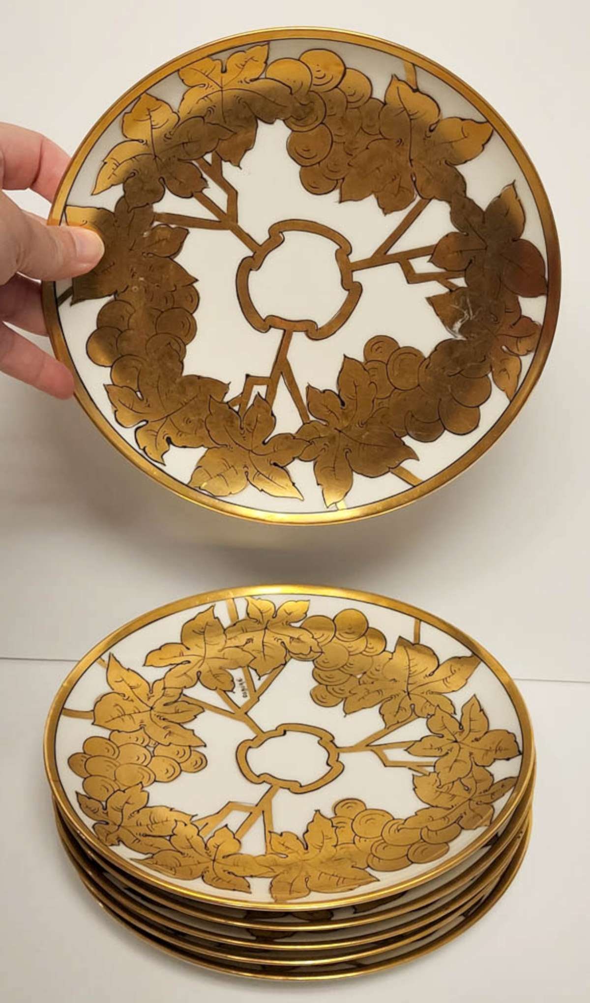 set of 6 antique Haviland French plates: lot of 6 bread plates marked Haviland France and White's Art Company Chicago with hand painted gilt grape leaf and cluster design and several with artist's name Osburn, as shown
