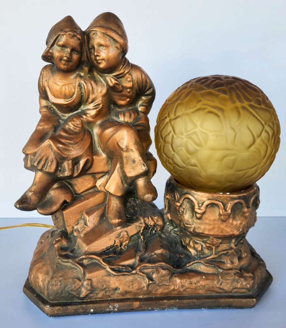 vintage chalkware Dutch kids table lamp: vintage or antique Art Deco period figural lamp depicting two children (a boy and a girl) wearing Dutch (from Holland or The Netherlands) clothing and wooden shoes sitting on steps and with an origina