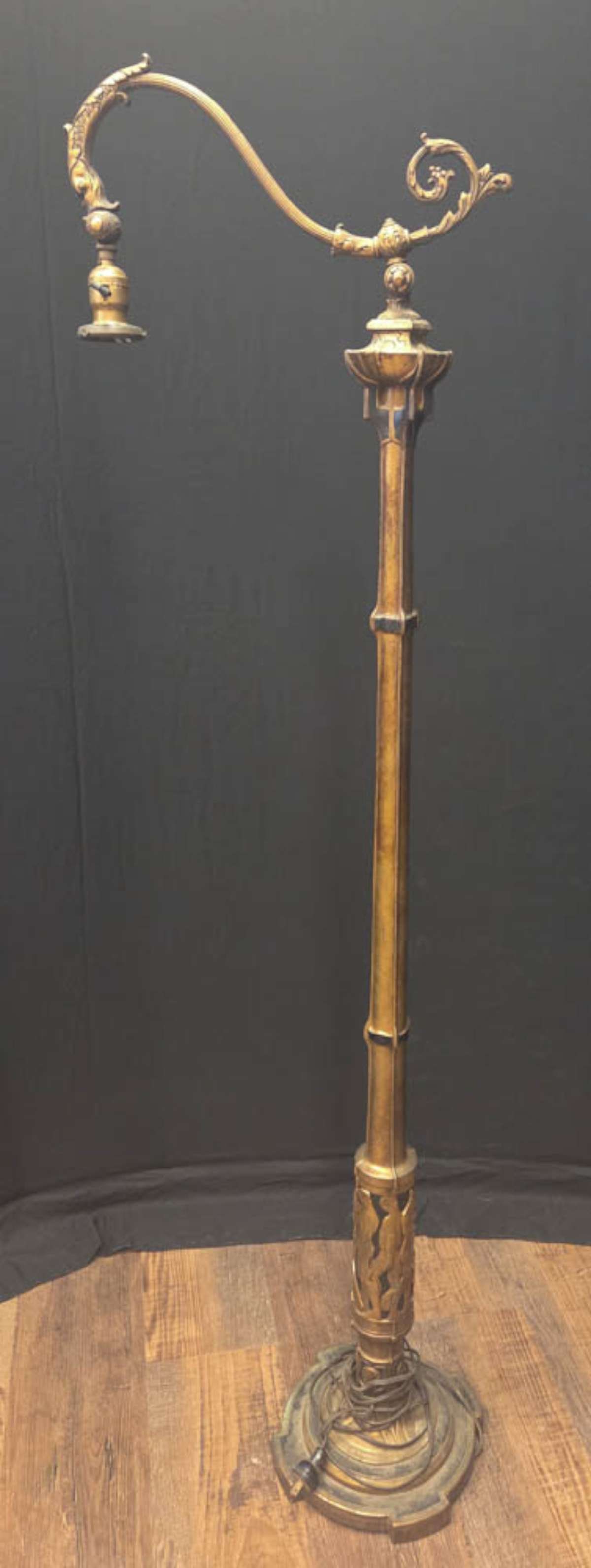 antique Art Nouveau gilt wooden bridge floor lamp: antique Art Nouveau or Art Deco period bronze and gilt wooden floor lamp with bridge arm with dolphin or fish design to hold the adjustable socket, abstract floral or flower top of the base part