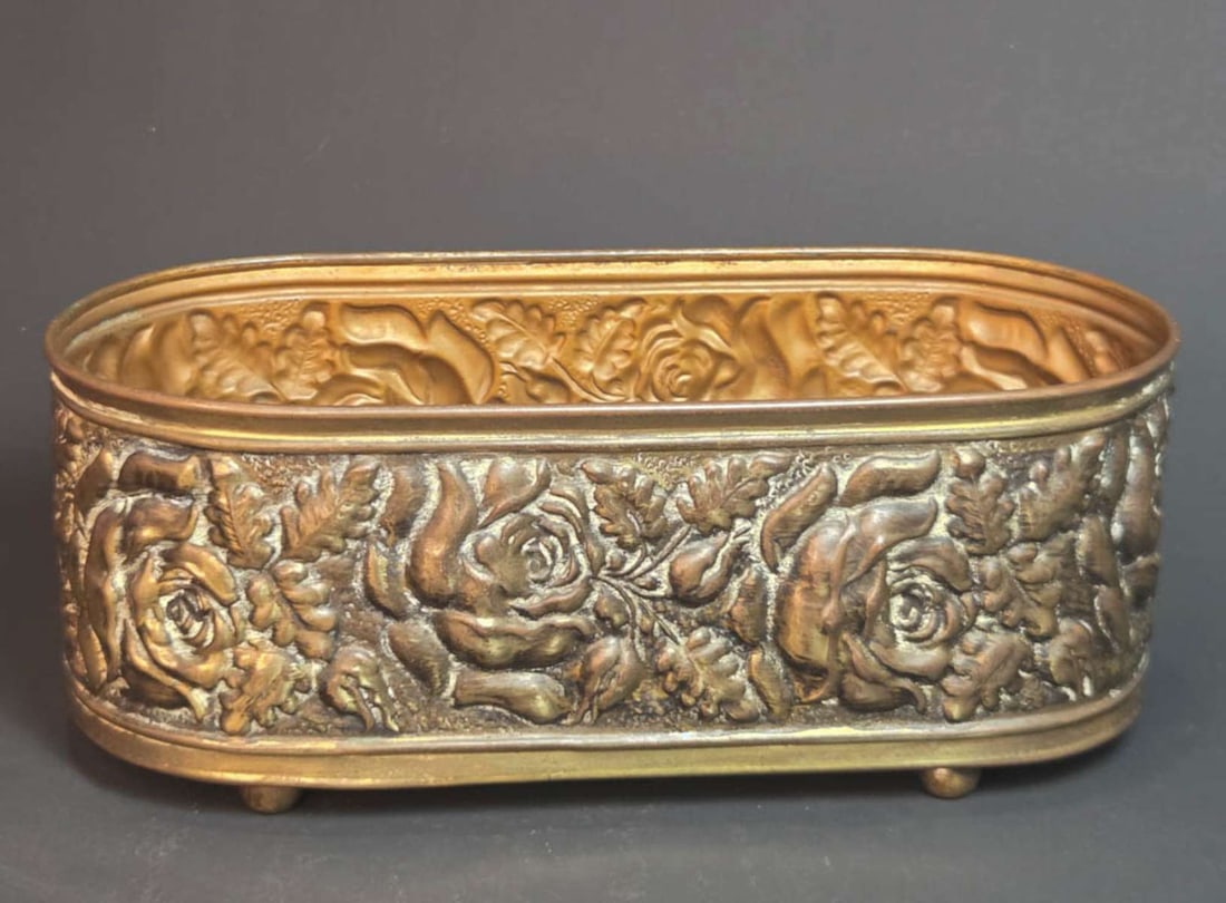 antique English brass Art Nouveau planter: repousse floral design with flowers (Roses) jardiniere or plant pot on ball feet, marked underneath Trade Mark Linton Made in England as shown 9" long by 3 1/2" wide