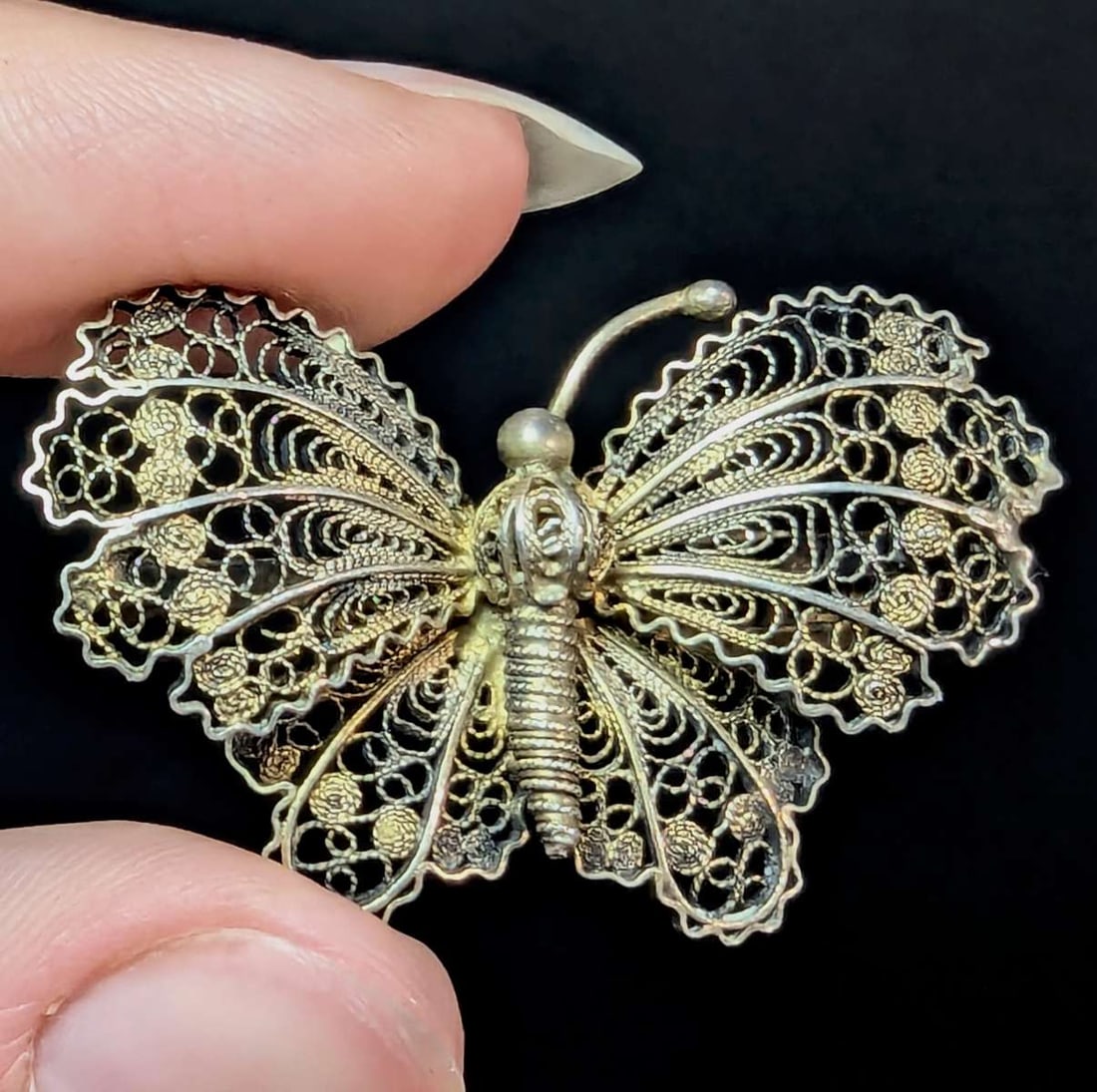 antique estate jewelry: filigree pin brooch: marked 800 for European silver antique filigree or wire pin shaped like a butterfly with gold filled or gilt finish aprox 1 3/4" wide