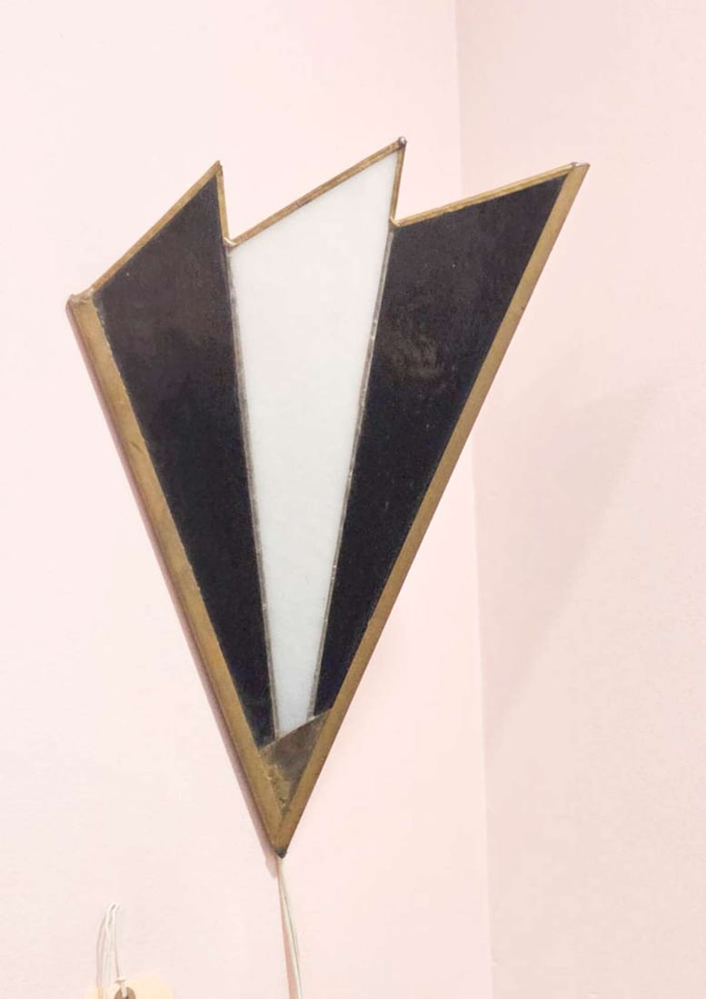 vintage Art Deco wall sconce: vintage or antique Art Deco brass and stained black and white glass paneled light fixture or uplight lamp, wall hung