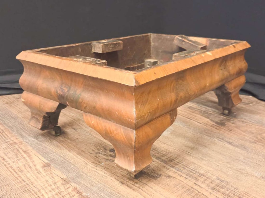 antique Empire foot stool: antique 1800's bookmark burl Mahogany rectangular foot stool base, on bronze castors or wheels about 14" wide by 20" long by 9" high