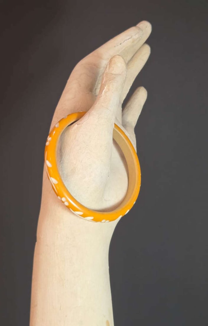 vintage estate jewelry: wooden bracelet: carved wooden bangle bracelet, yellow to white with spoon carved abstract floral or flower design