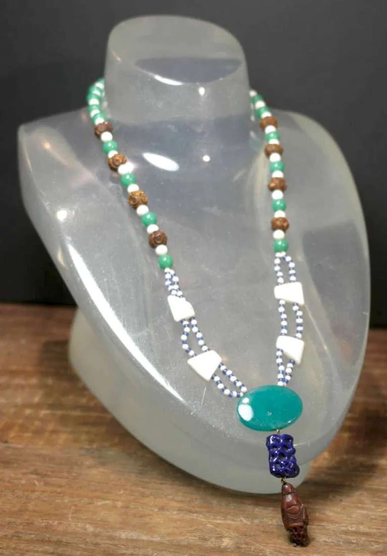 vintage estate jewelry: Asian necklace with Buddha: unusual mixed media necklace with green Jade (Jadeite?) and white stone beads with carved wood or nut beads and 2 blue pendants with carved Buddha or Saint or wise man bead at the end, possibly 