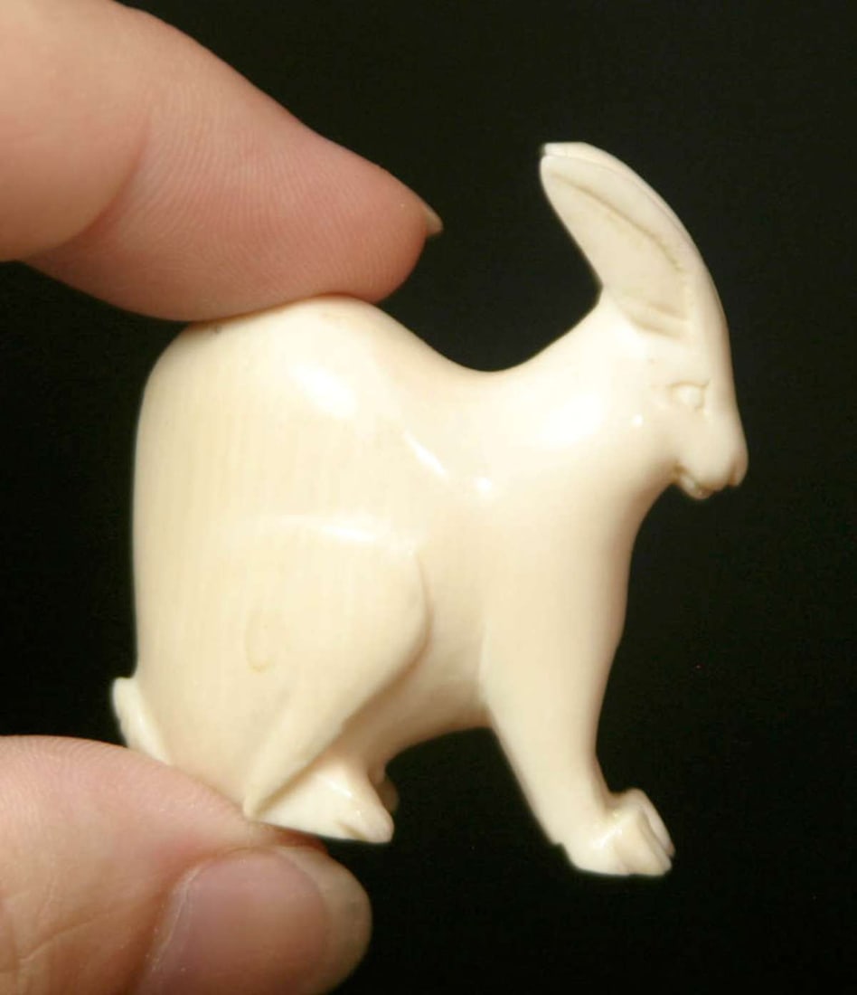 vintage Asian carved bone animal object: small abstract hare or rabbit shaped carved bone Zodiac charm or animal Okimono, unsigned Info from online search: "In Chinese culture, a rabbit charm symbolizes various positive attr