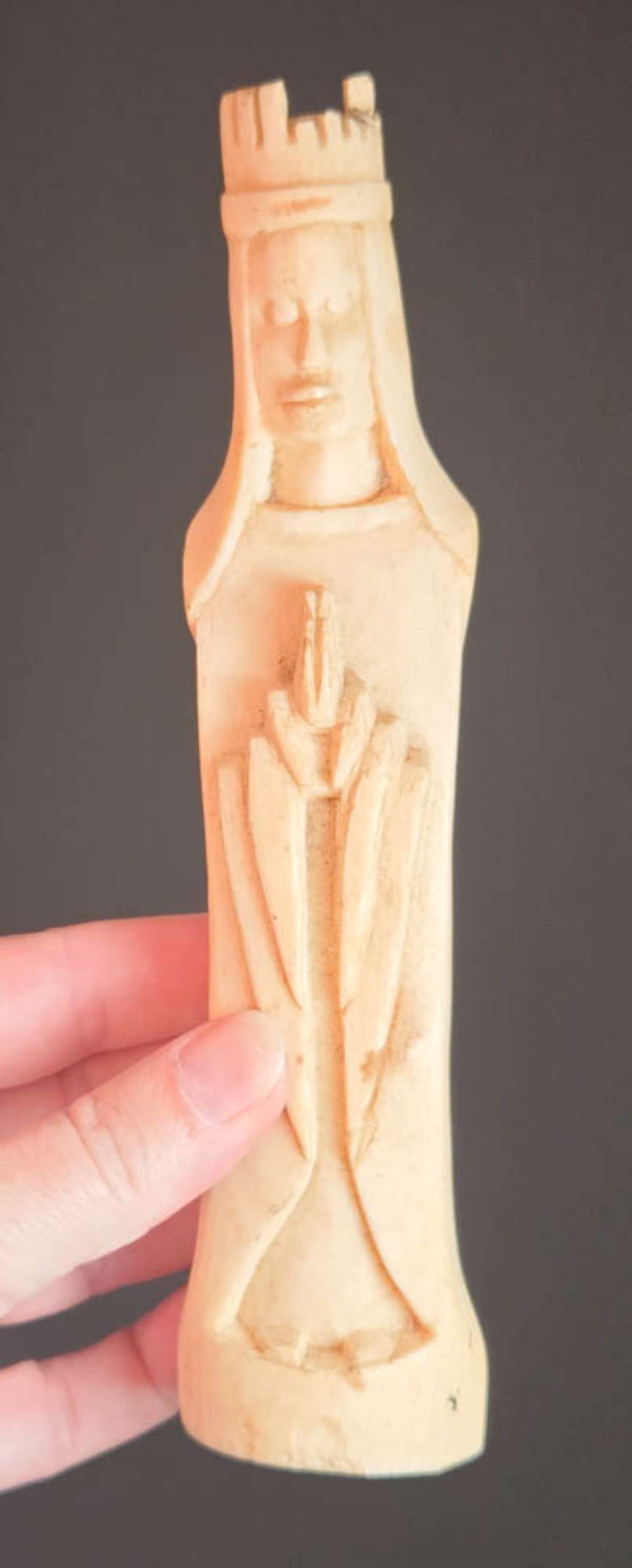 antique bone carved Santos: antique bone carved figural statue or figurine of a man or woman with a crown on their head and their hands folded in prayer, possibly a Santos or other religious figure, appears unsigned