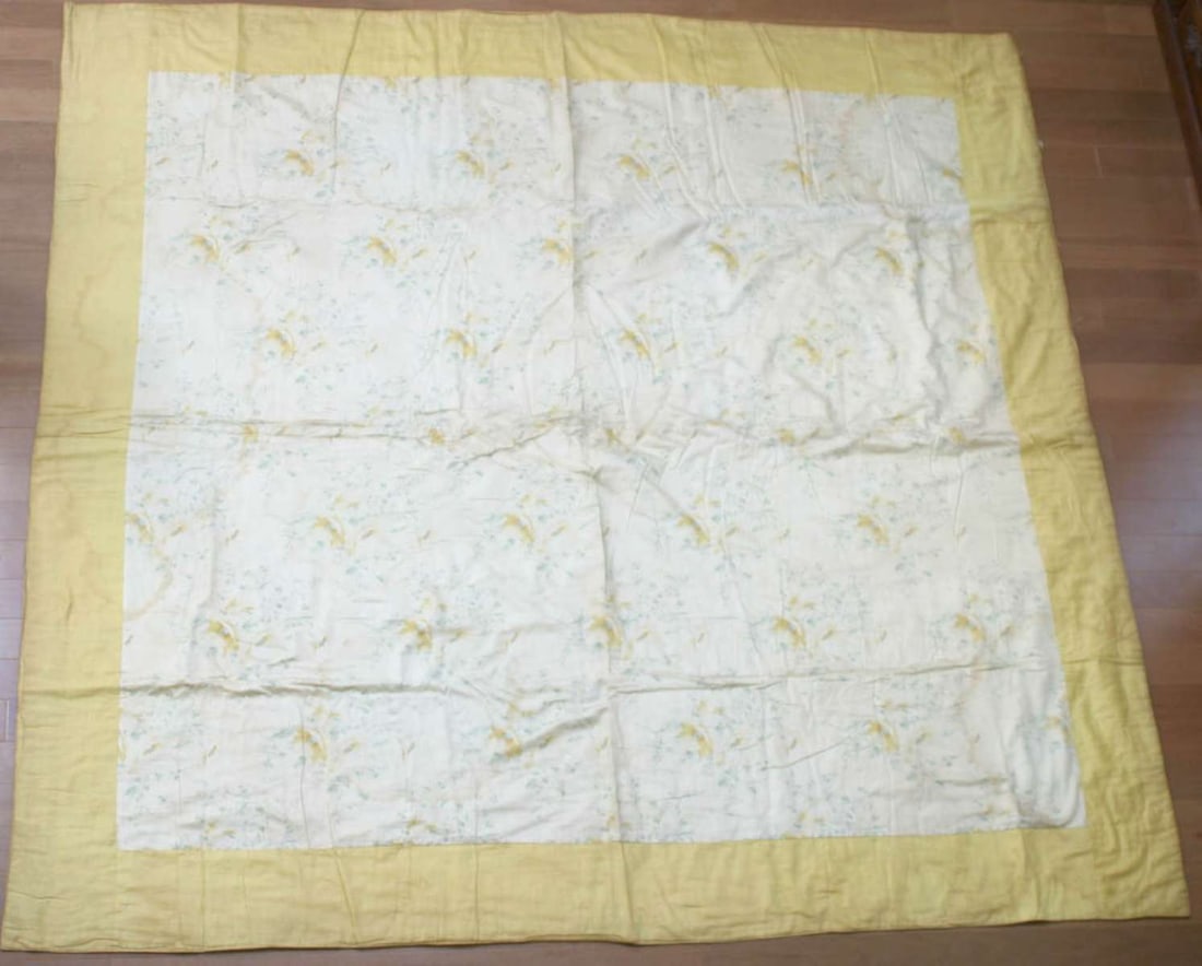 vintage hand knotted and sewn quilt: vintage hand stitched quilt, with yellow fat border and center with white background and yellow and green floral or flower design, likely rayon fabric, reversible quilt but string kn