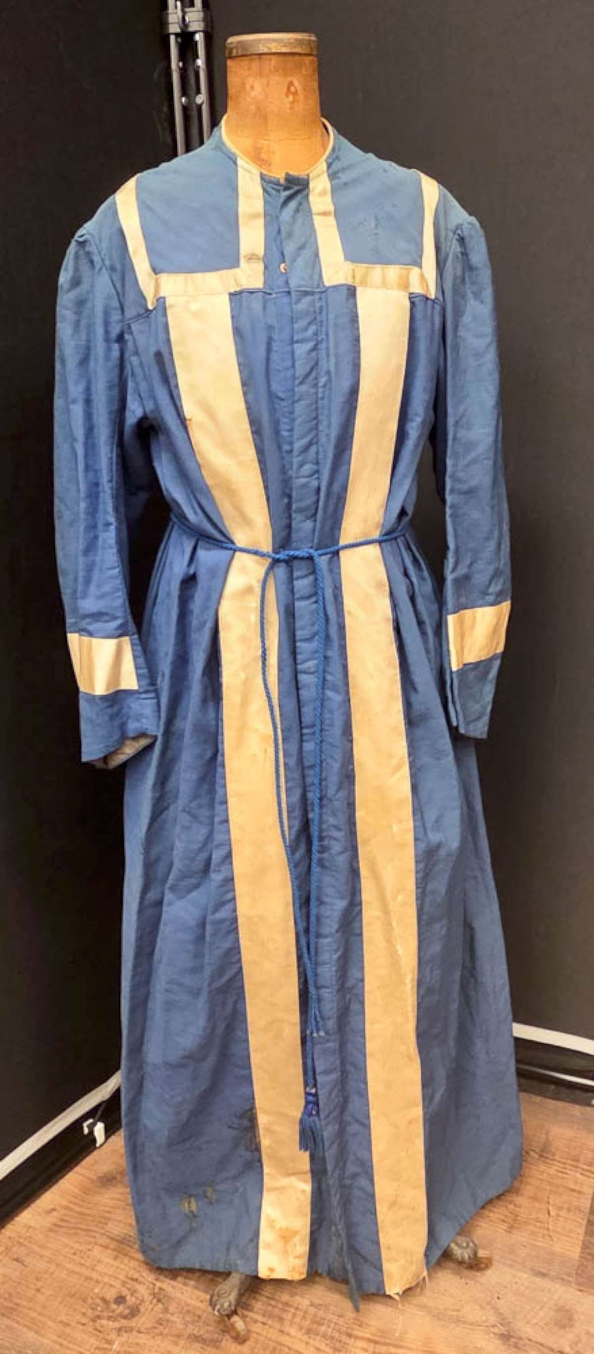 antique ceremonial robe or dress: vintage or antique heavy cotton blue dress or robe with cream colored silk striped accent pattern and simple blue cord sash or belt closure, snap buttons down the front, not sure if this w