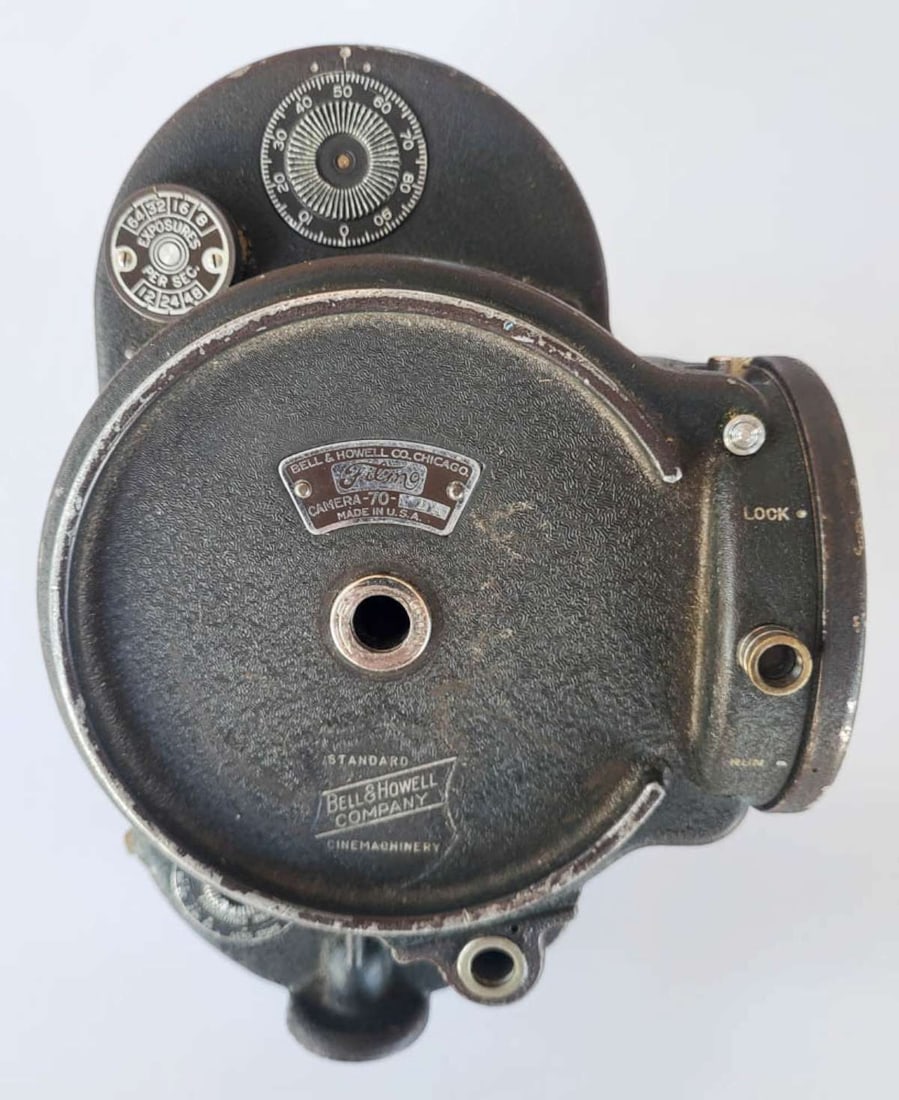 vintage Bell and Howell 70 Filmo camera: probably WWII or World War 2 Era Standard Cinemachinery Model Made in USA camera, unknown condition and possibly missing parts