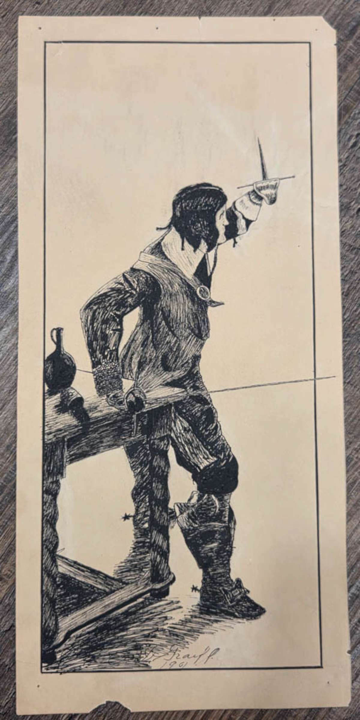 signed antique ink drawing of a pirate: signed (illegible first name) Graff and dated 1901 as shown, this is an ink drawing on paper depicting a man in unusual clothing and with spurs on his boots, holding a cutlass sword,