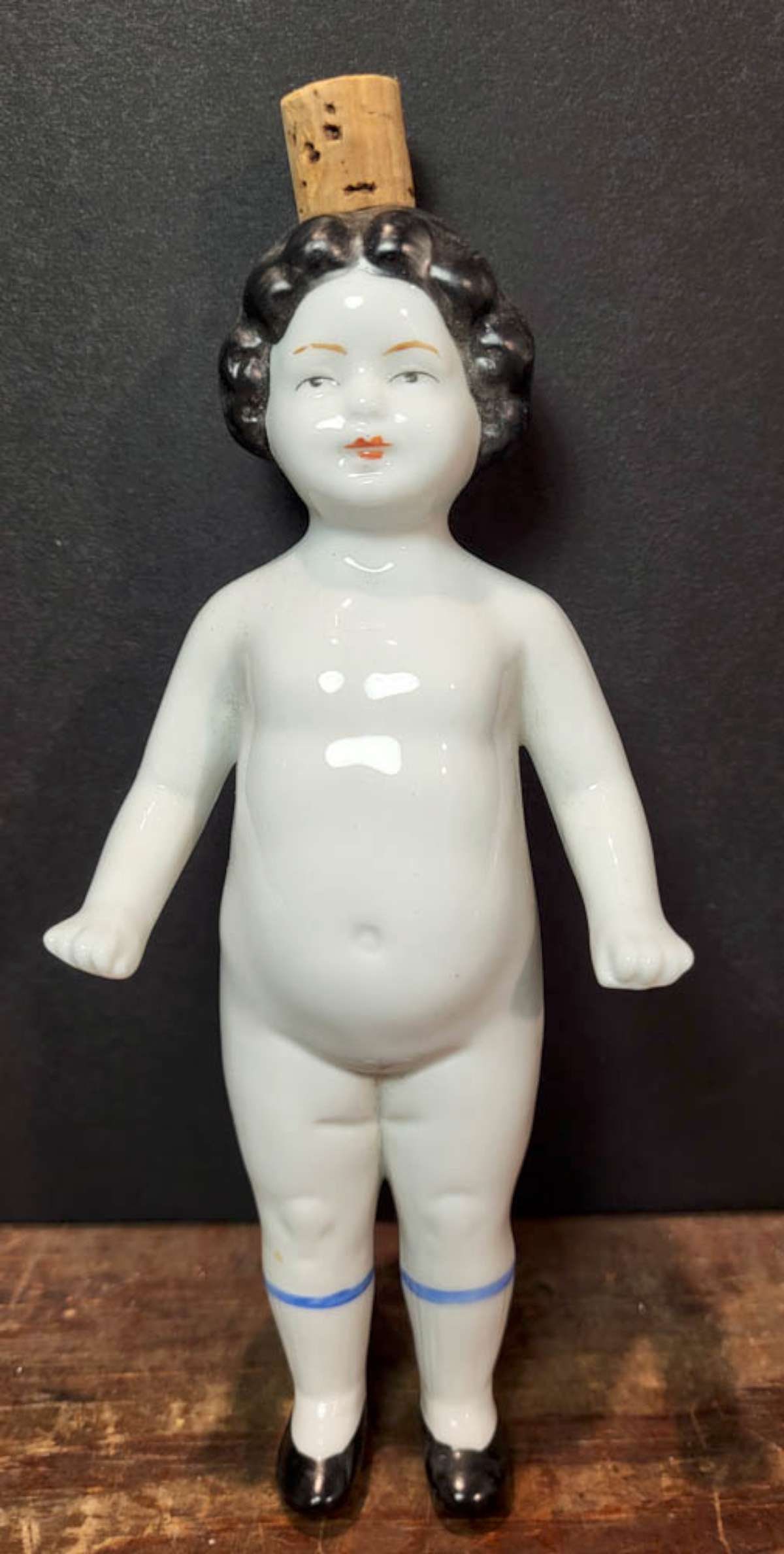 vintage German Badekinder liquor flask: marked Made in Germany porcelain "Frozen Charlotte" or bathing doll, with cork.....possibly a perfume or bath salt flask or bottle and dated 2004