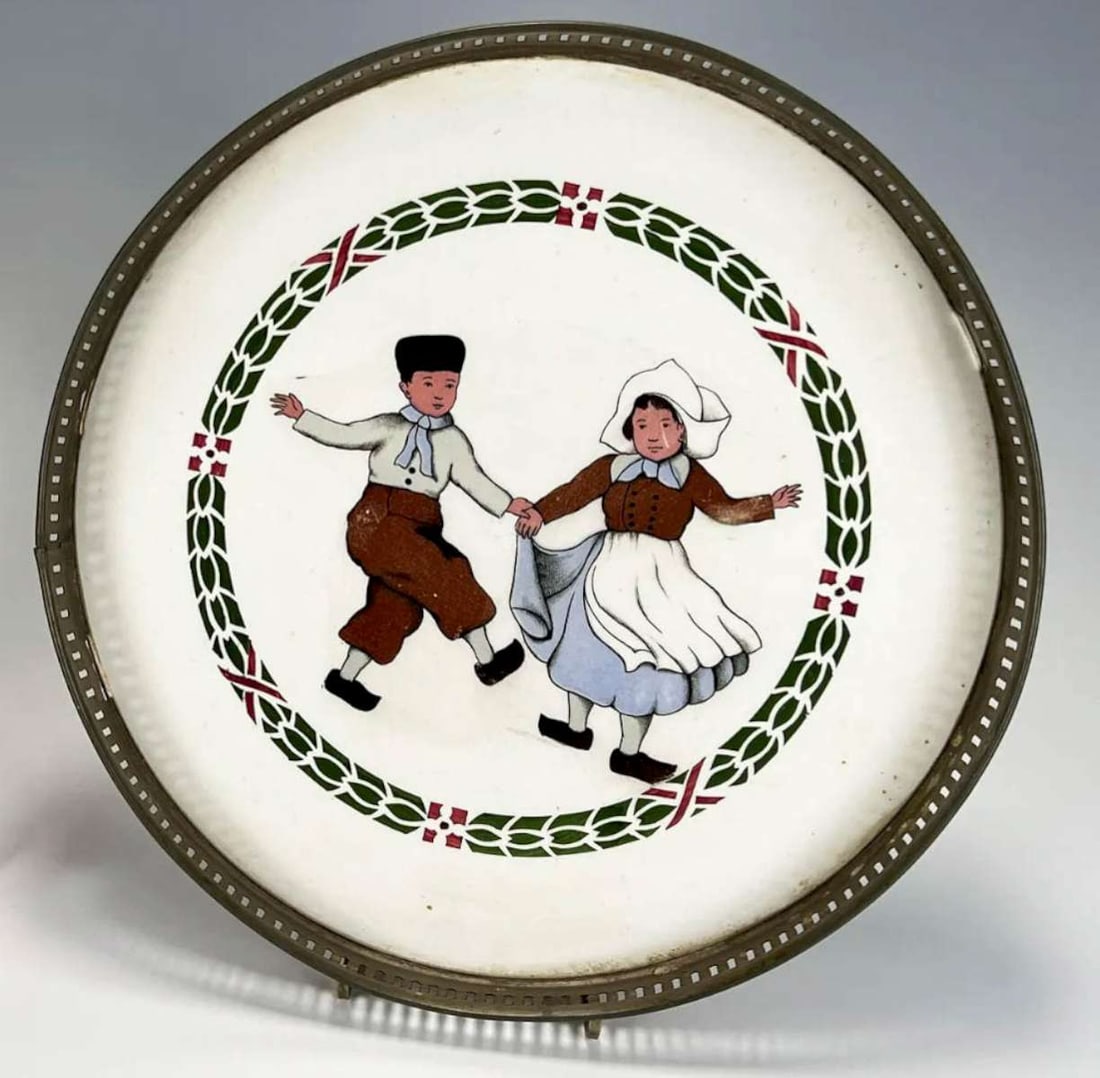antique German porcelain barware tray: porcelain round plate made into a tray with a decorative metal rim and center scene of a Dutch or Belgian boy and girl, stamped Sternauware NY on the metal rim and is marked 1913 Germany 6081 on