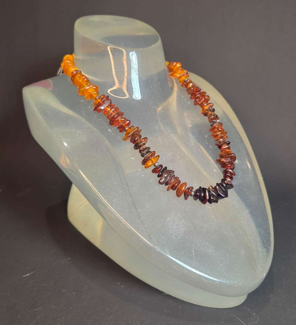 vintage estate jewelry: Amber necklace: vintage or antique necklace with real Amber polished chips, in graduating colors ranging from Coca Cola to Applejuice, with unmarked silver toned modern clasp about 19" long