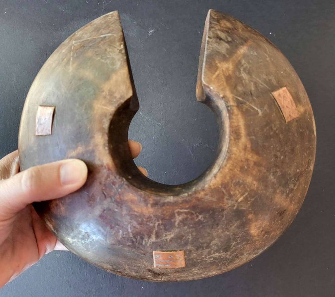 antique Tutsi warrior archer's cuff: heavy and thick curved wooden guard with copper inlays, see more info below roughly 7 1/2" diameter by 3" thick Info from online search: "A Tutsi archer's cuff, also kn