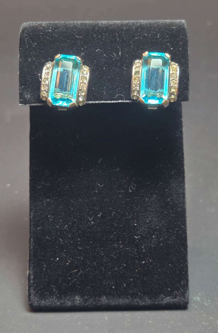 vintage estate jewelry: Crown Trifari earrings: vintage pair of marked Trifari clip earrings with blue Topaz or Aquamarine center stone and flanked by clear cut rhinestones, or paste or diamante, probably silver plated and a great MCM o
