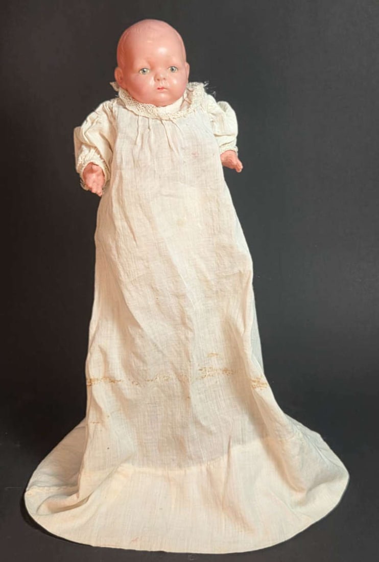 vintage plastic doll made in Japan: marked on the back as shown, early 1900's plastic or celluloid baby doll with painted blue eyes, movable arms and legs and in antique pantaloons and dress (both too large) about 8 3/4