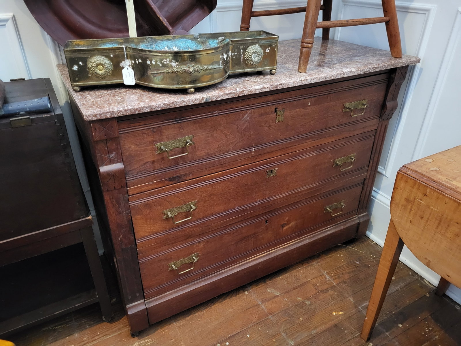 antique Victorian Eastlake dresser: Victorian Eastlake dresser with variegated rouge marble top, in great condition for its age (ca. 1890-1910), with the original drawer pulls and on castors or wheels about 42 1/4" wide