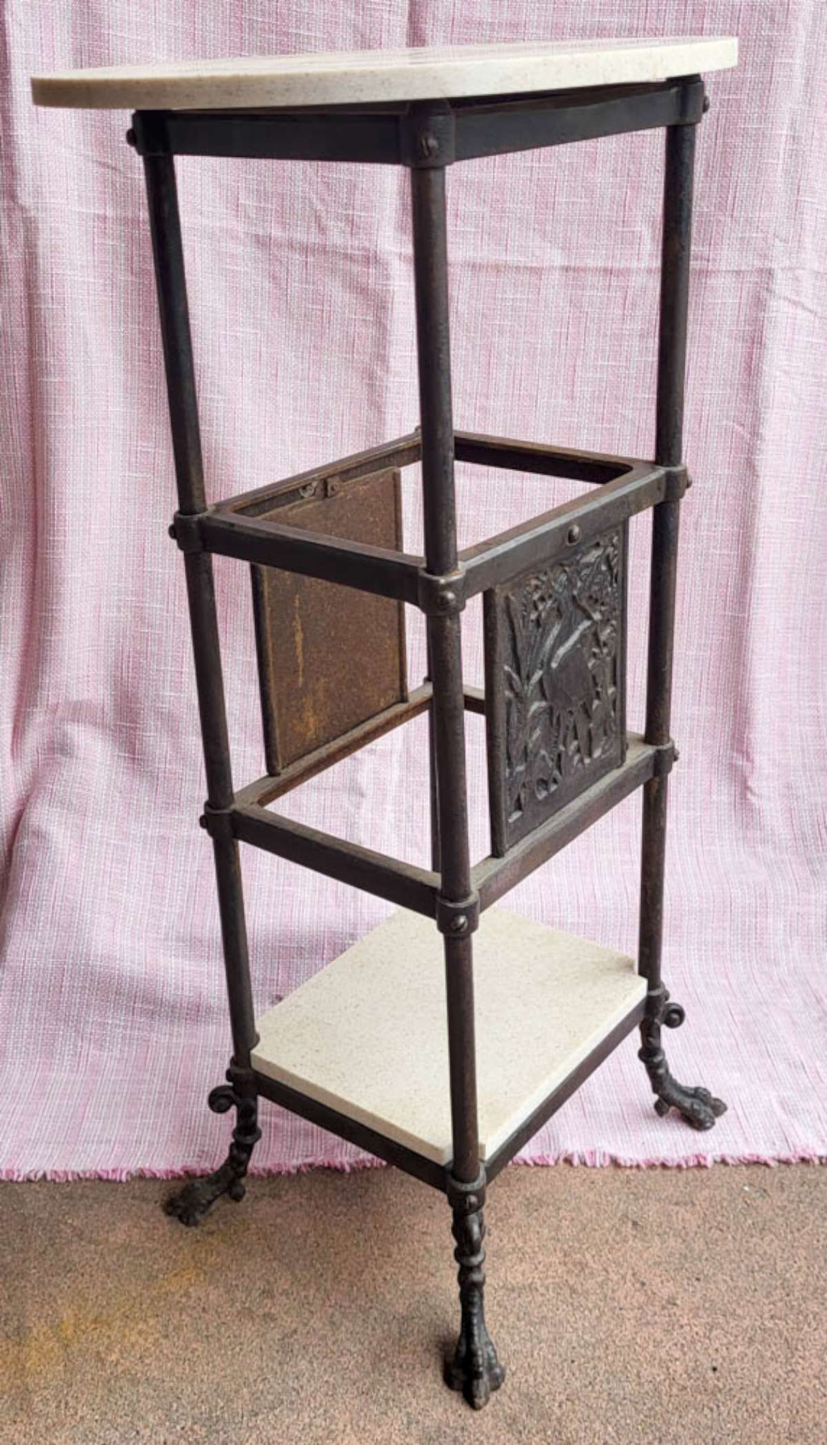 antique Art Deco period side table: vintage or antique Art Deco period cast iron tall occasional table with bird designs on both sides (a Heron or Egret in tall grass) and set on claw or paw feet, with later added top and bottom s