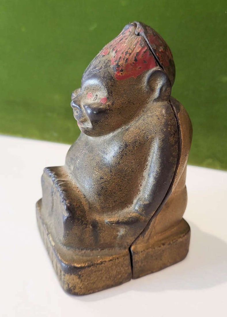 antique cast iron coin bank Billiken: antique Buddha coin bank with remnants of the gold and red paint, marked with the patent number and Good Luck on the back as shown