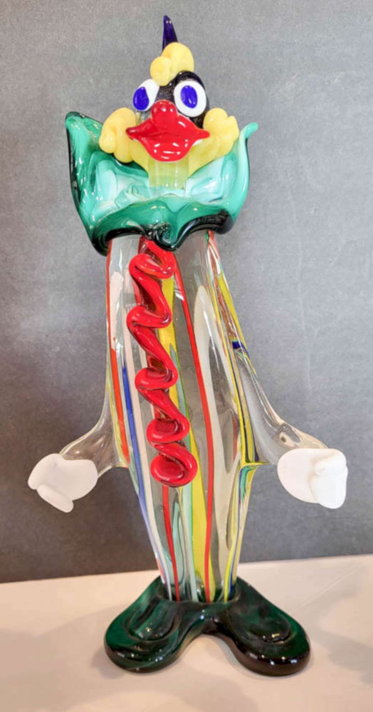 vintage Murano glass clown sculpture: reported by owner to have been purchased in Italy, this is an unmarked but very likely a Murano tall (and heavy!) glass figural statue, shaped like a clown with a colorful striped outfit