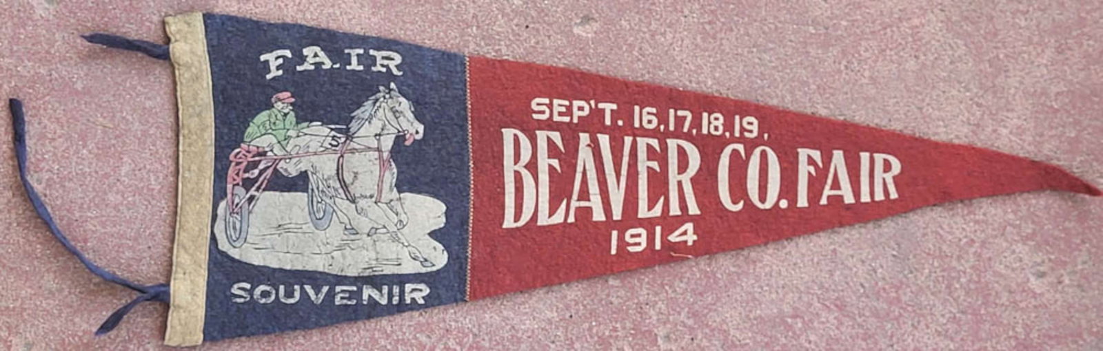 antique Pennsylvania 1914 fair pennant: antique felted wool flag or pennant with dark blue and dark Maroon red and Fair Souvenir September 16, 17, 18, 19 Beaver County 1914 and with depiction of a jockey with his horse and
