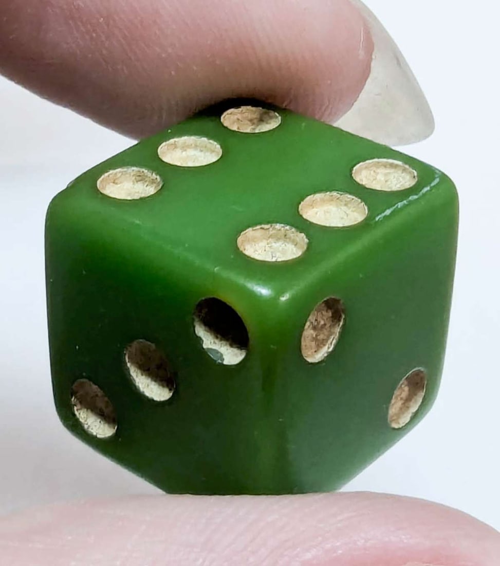 antique Bakelite gambling dice: green Bakelite small die with painted white or cream colored dots about 5/8" squared