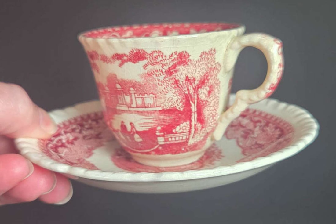 pair English ironstone transferware demitasse cups: set or lot of two beautiful vintage or antique ironstone china demitasse or coffee cups and matching saucers in the pink Vista pattern, border of the saucers with leaf design and center on the c