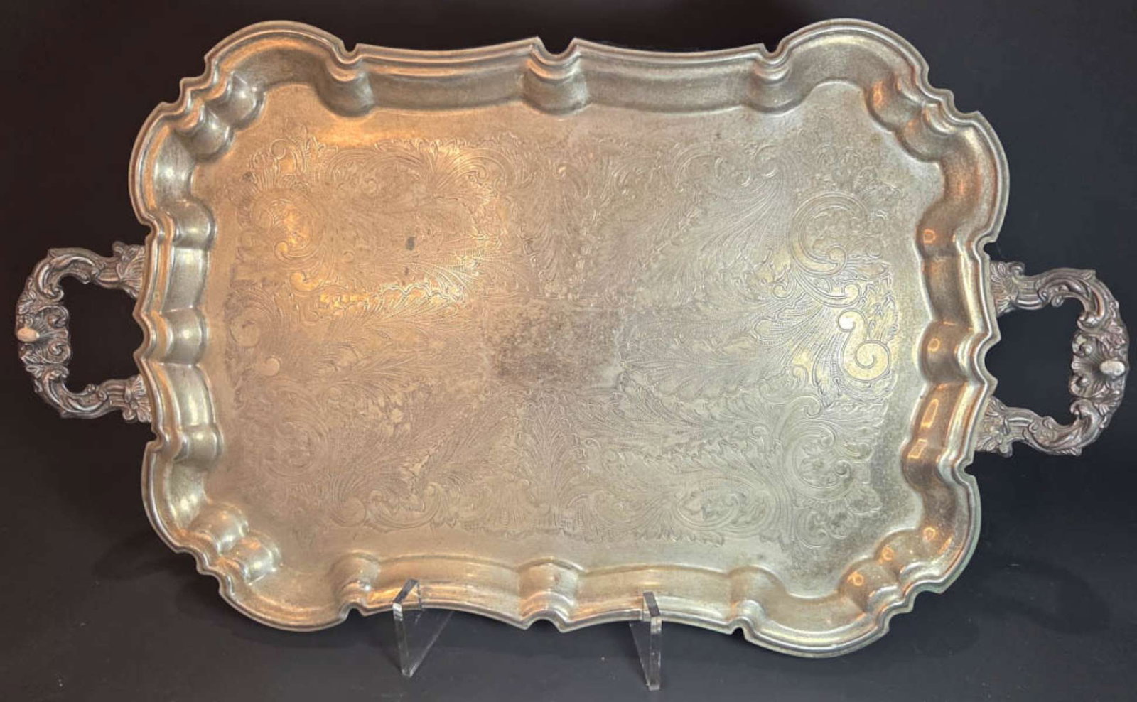 antique silver plated serving tray: marked for Leonard electro plated large serving tray with two handles and decorative paw feet and engraved center 23 3/16" long (plus handles) by 13 5/8" wide by 3" high (inlc. handles)