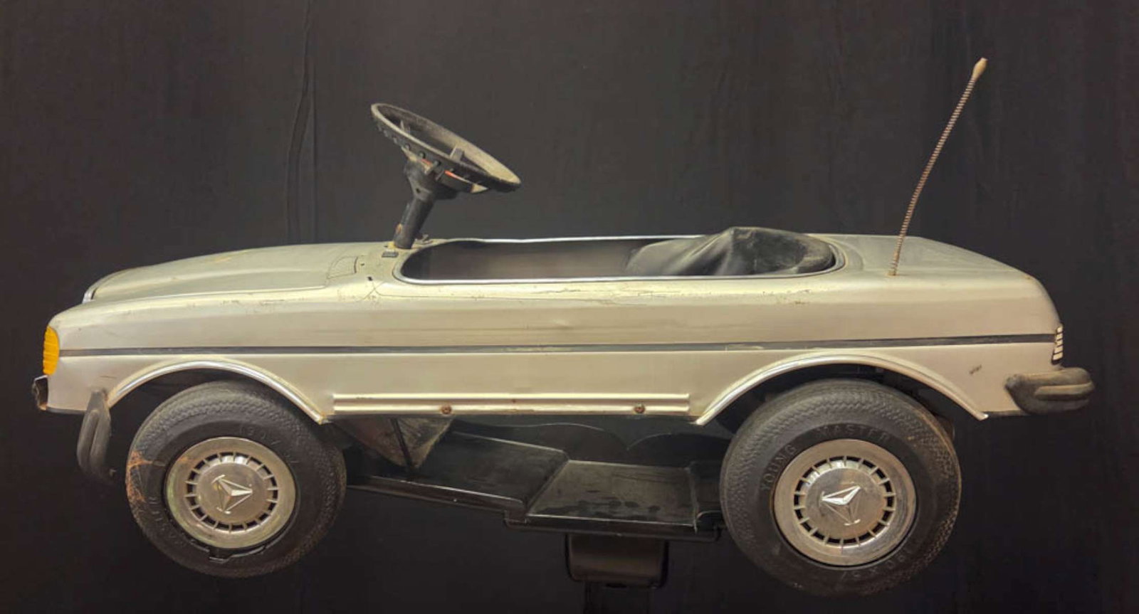vintage Mercedes pedal car childs toy: vintage 1980's Mercedes Benz Junior Sportster 500 SEI Turbo pedal car in silver and black colors about 17" wide by 37" long by aprox. 17" high (tires to steering wheel)