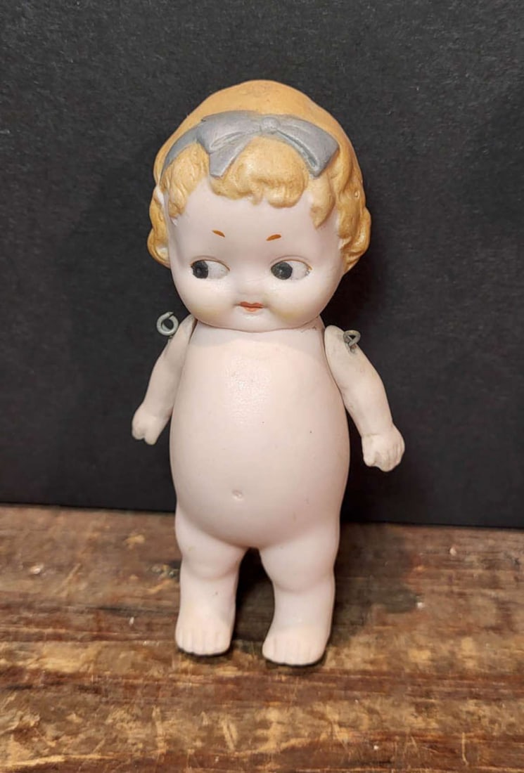 miniature antique German bisque dollhouse doll: marked Made in Germany ca. early 1900's side-glancing doll with moulded blonde hair and movable arms about 3 3/4" tall