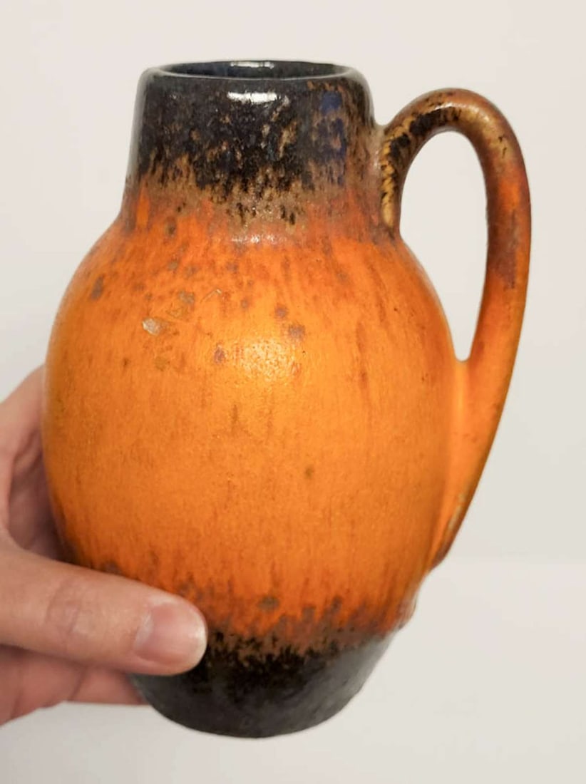vintage West Germany pottery vase: vintage ca. 1950's or 60's illegibly marked but likely Scheurich made fat lava handled pot with orange peel and black brown glaze