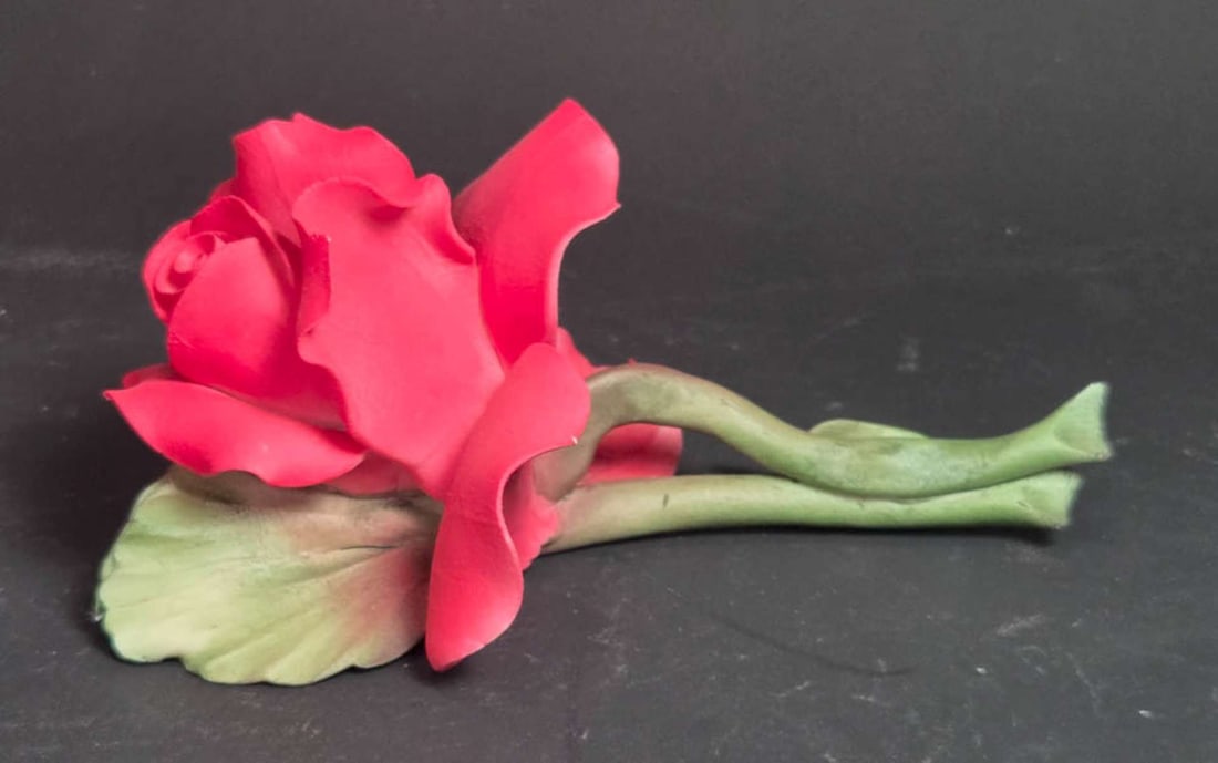 vintage Italian bisque floral sculpture: vintage red flower with green leaf and stem, marked as shown N and Capodimonte aprox. 6 3/4" long by 2 3/4" high