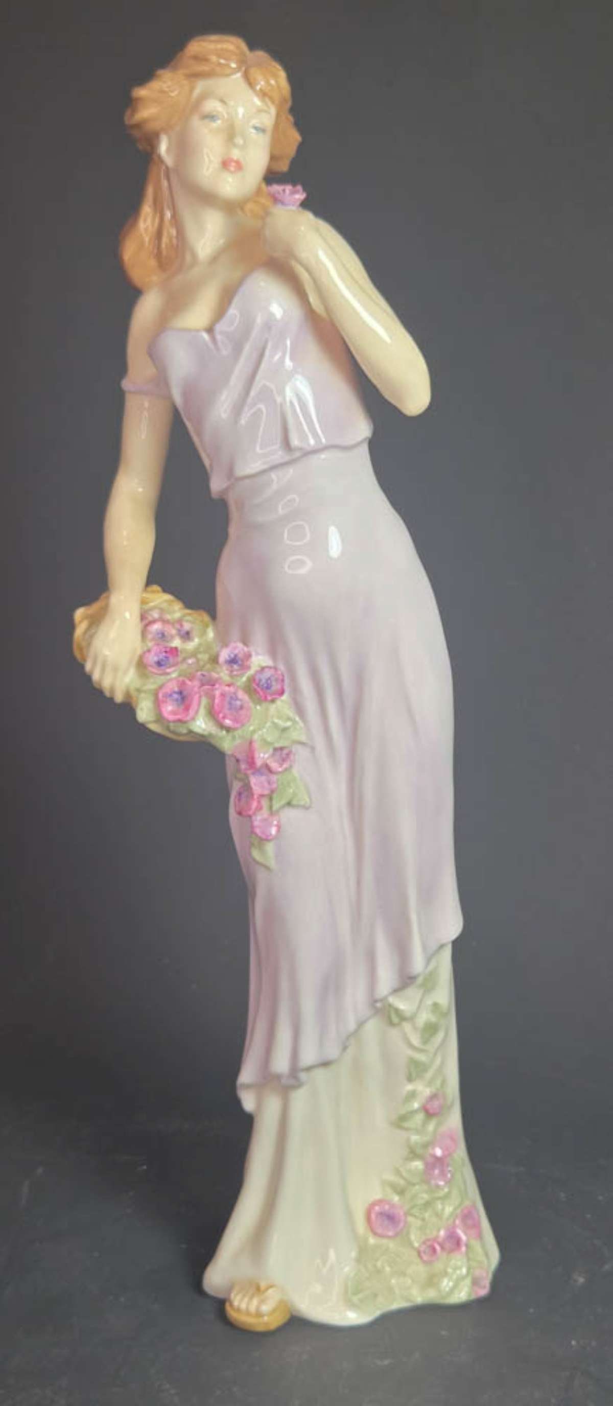 vintage Royal Doulton lady figurine: vintage 1999 English porcelain Tender Moments HN 4192 tall statue of a woman in a lilac purple dress and holding a basket of flowers about 12 1/2" tall
