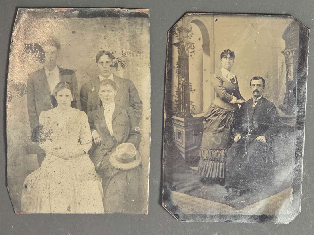 pair antique tintype photographs: set or lot of two ca. 1890's tintype photographs, one a black and white portrait photograph of a lady standing next to her husband seated on a parlor chair with an interior scene backdrop&c