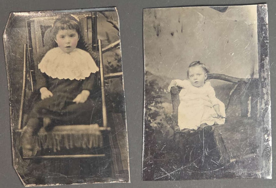 pair antique tintype photographs: set or lot of two ca. 1890's tintype photographs, both black and white portraits of children sitting in chairs and with painted backdrops, older girl with hand tinted cheeks tallest a