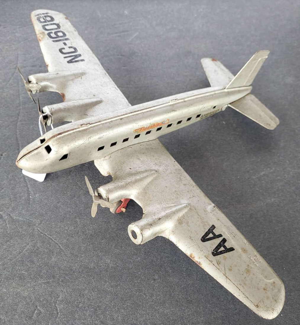 ca. 1940s Marx toy airplane: vintage ca. 1940's Made in USA toy airplane named "Flagship", made by Marx and with numbers on the wings American Airlines, pressed tin and with decals as shown