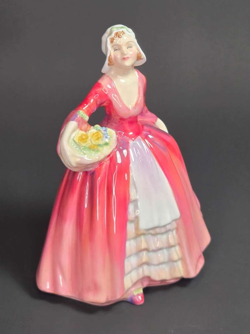 vintage Royal Doulton lady figurine: marked as shown underneath Royal Doulton Janet H.N. 1537 1932, depicting a woman in a flowing pink and red dress with white bonnet and holding a basket of flowers
